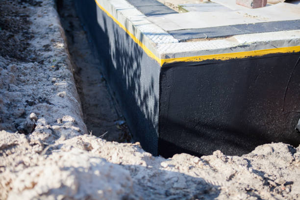 Professional Waterproofing technician working in Seminole, AL